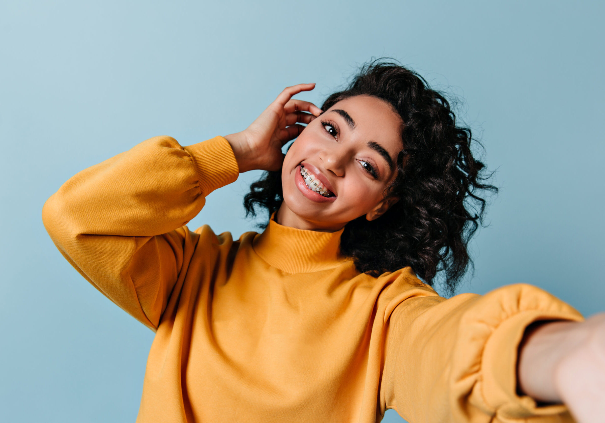 Pleased,Girl,In,Dental,Braces,Taking,Selfie.,Studio,Shot,Of